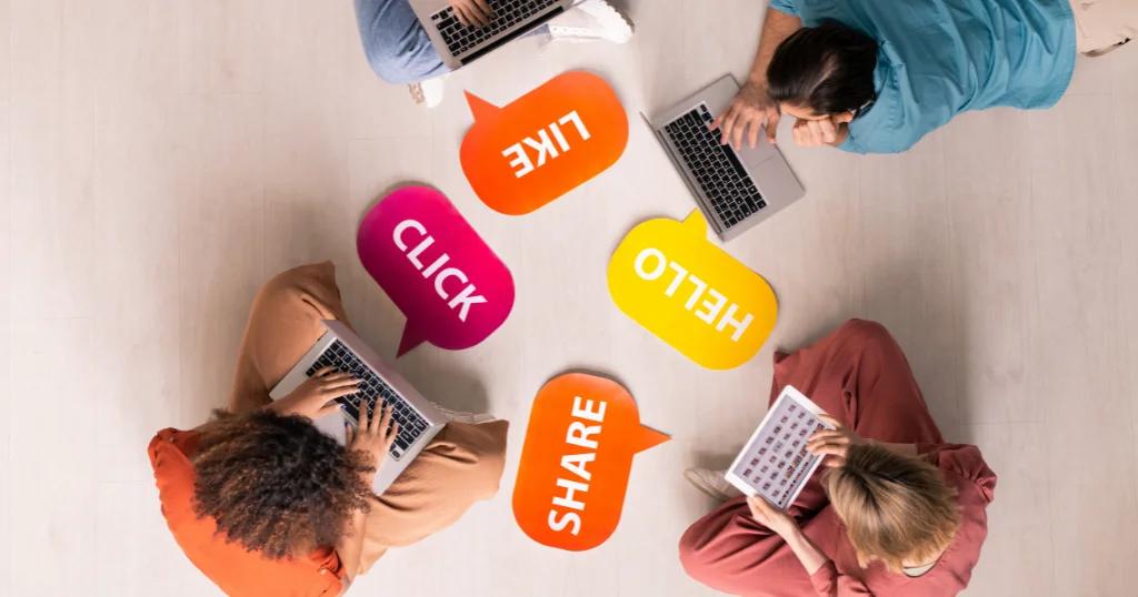 Creative team planning Social Media Marketing in London with laptops and engaging keywords.