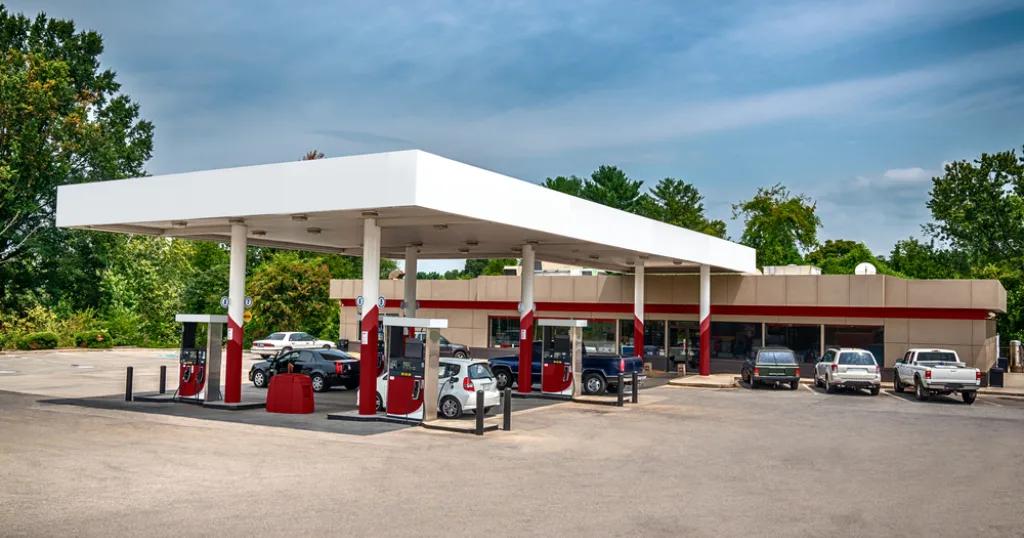 A spacious petroleum retail service station with multiple fuel pumps and a convenience store in Birmingham.